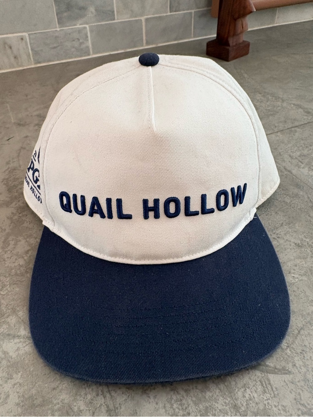This white and navy PGA Championship golf hat features Quail Hollow embroidery.